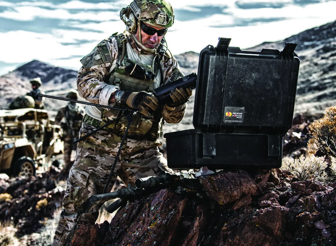 Soldier opening a Pelican Storm case in the field